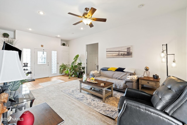 tiled living room featuring ceiling fan