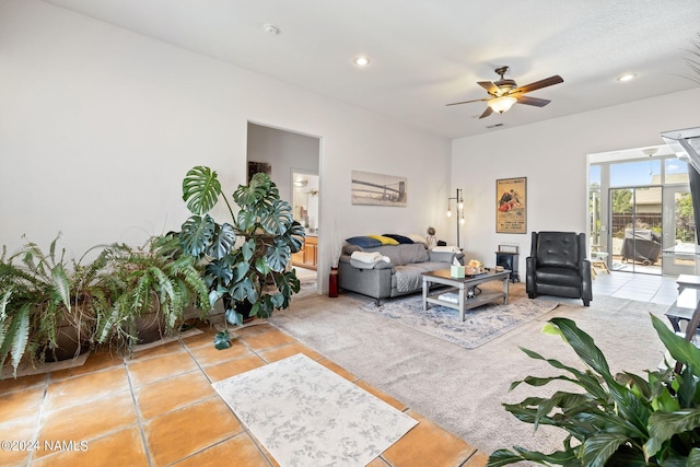 living room featuring ceiling fan and light tile patterned floors