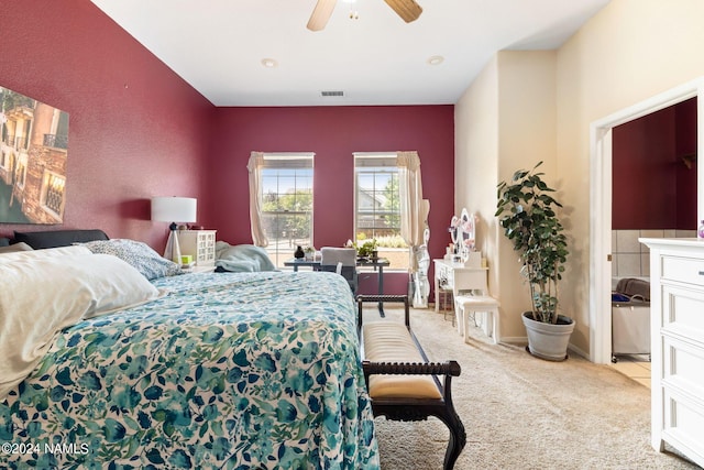 bedroom with ceiling fan and light carpet