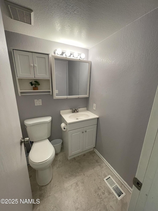 1200 S Riordan Ranch St Unit 44, Flagstaff, AZ 86001 - bathroom with vanity and a textured ceiling