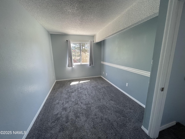 1200 S Riordan Ranch St Unit 44, Flagstaff, AZ 86001 - spare room featuring a textured ceiling and carpet flooring