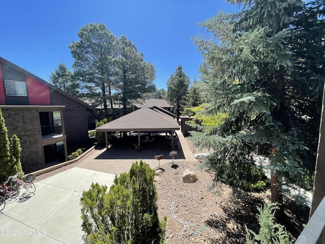 1200 S Riordan Ranch St Unit 44, Flagstaff, AZ 86001 - back of property featuring driveway, a gazebo, a carport, and brick siding