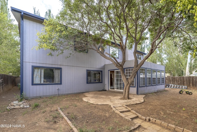 back of property with a patio