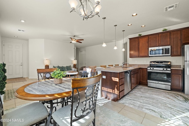 3008 E Cold Springs Trl, Flagstaff, AZ 86004 - kitchen featuring light tile patterned flooring, visible vents, stainless steel appliances, and a sink