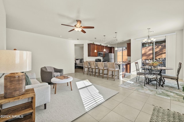 3008 E Cold Springs Trl, Flagstaff, AZ 86004 - living area featuring light tile patterned flooring and ceiling fan with notable chandelier