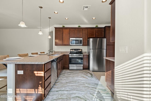 3008 E Cold Springs Trl, Flagstaff, AZ 86004 - kitchen with a peninsula, a sink, recessed lighting, and appliances with stainless steel finishes
