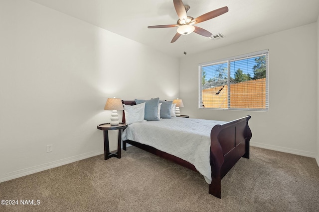 3008 E Cold Springs Trl, Flagstaff, AZ 86004 - carpeted bedroom with baseboards, a ceiling fan, and visible vents