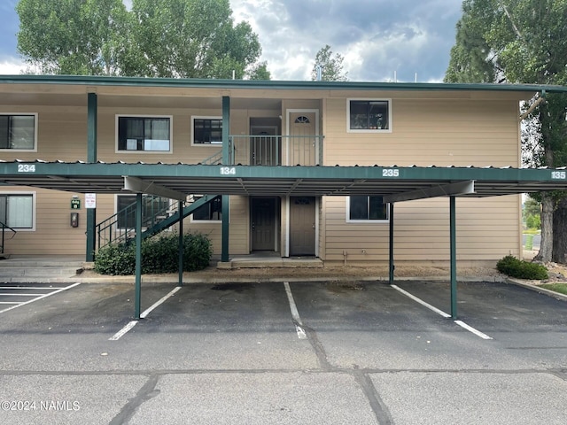 3200 S Litzler Dr Unit 8, Flagstaff, AZ 86005 - view of property featuring covered parking and stairs