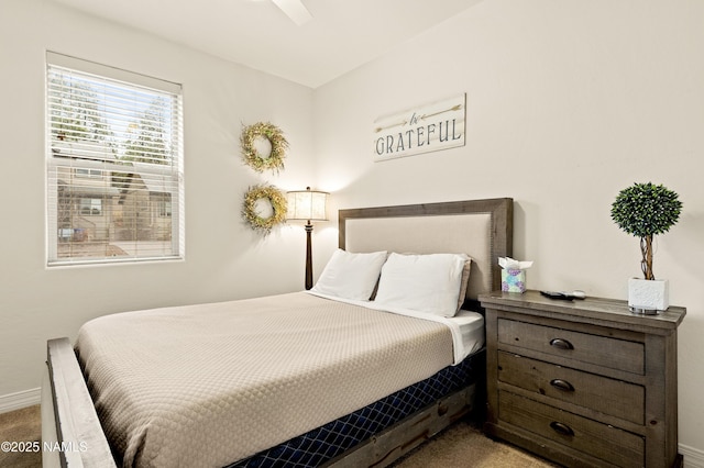 bedroom with carpet flooring and baseboards