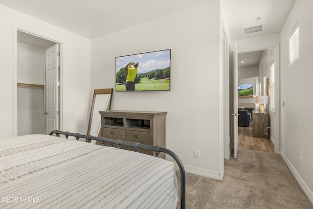 bedroom featuring carpet, visible vents, and baseboards