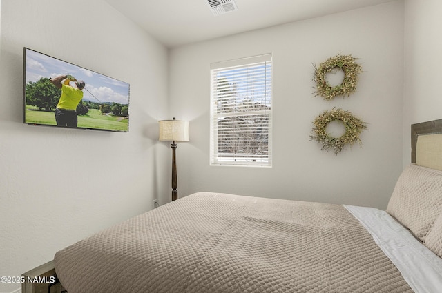 bedroom featuring visible vents