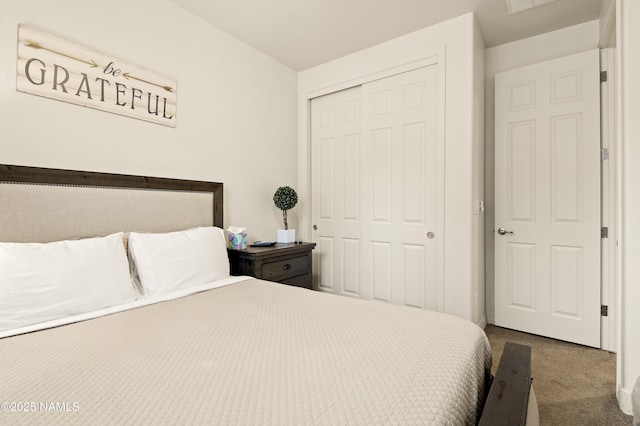 bedroom with carpet floors and a closet