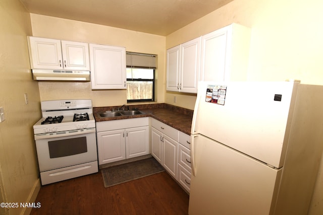 417, 429 W Sheridan Ave, Williams, AZ 86046 - kitchen featuring white appliances, under cabinet range hood, a sink, dark wood finished floors, and white cabinetry