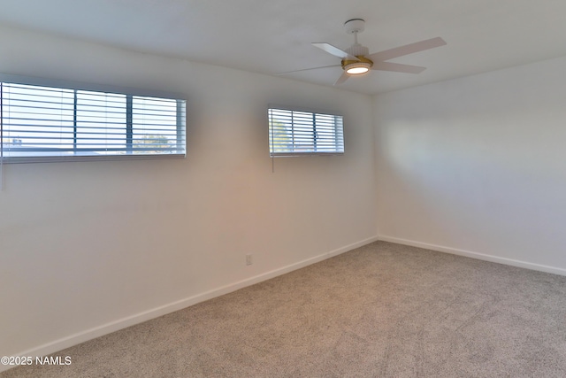 1009 Bales Ave, Winslow, AZ 86047 - spare room with carpet flooring, baseboards, and a ceiling fan