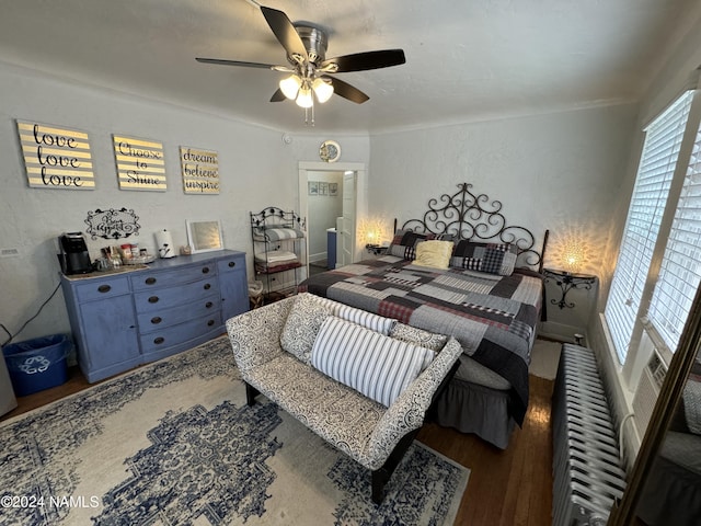 bedroom featuring ceiling fan and hardwood / wood-style floors