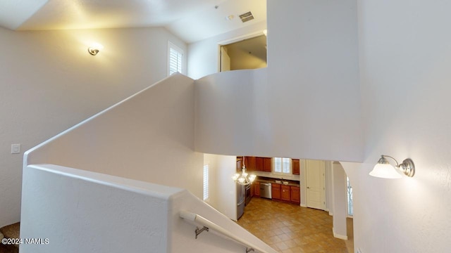 staircase with vaulted ceiling