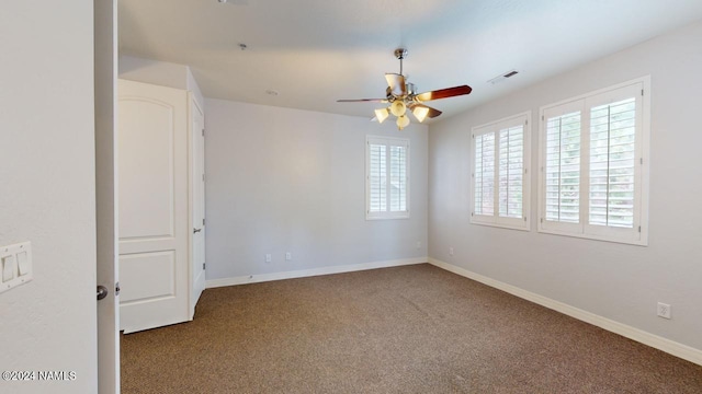 spare room with ceiling fan and carpet flooring