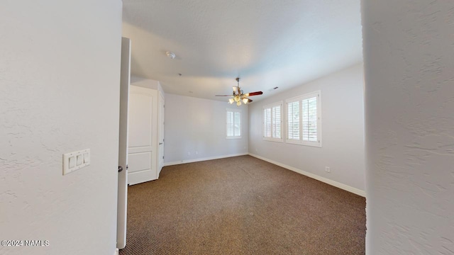 unfurnished room featuring carpet flooring and ceiling fan