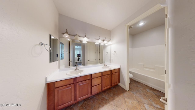 full bathroom featuring vanity, toilet, and bathing tub / shower combination