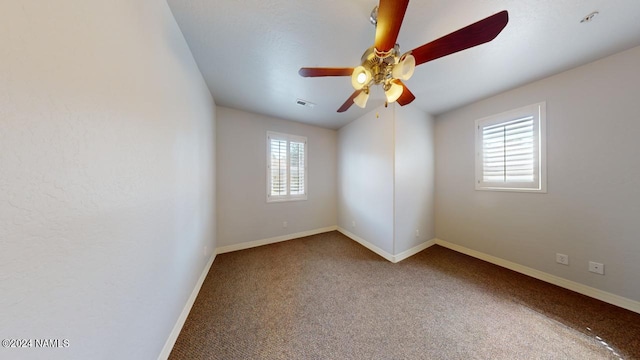 carpeted empty room with ceiling fan