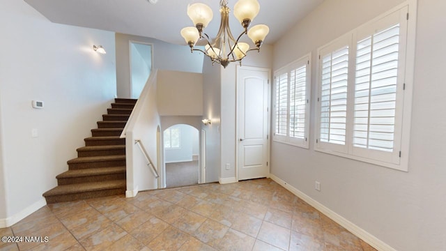 foyer featuring a notable chandelier