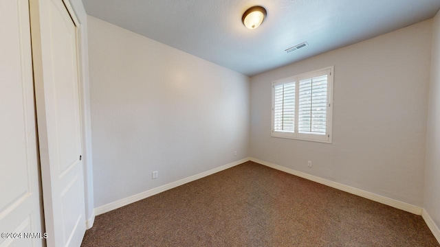 spare room featuring carpet