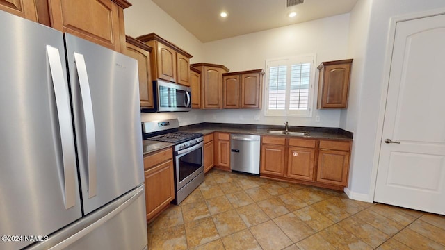 kitchen with sink and appliances with stainless steel finishes