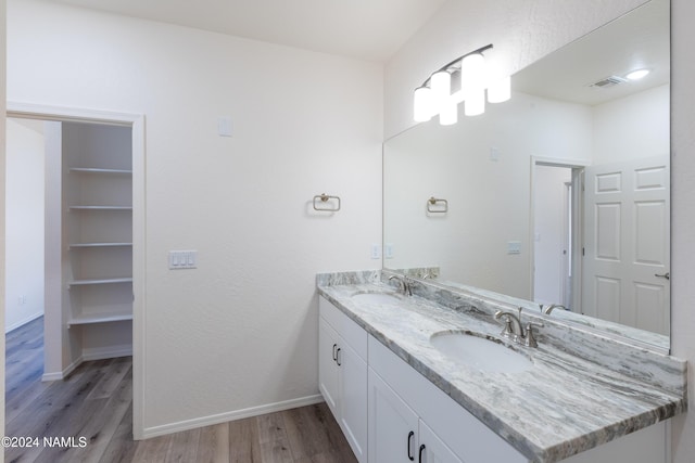 bathroom featuring vanity and hardwood / wood-style flooring