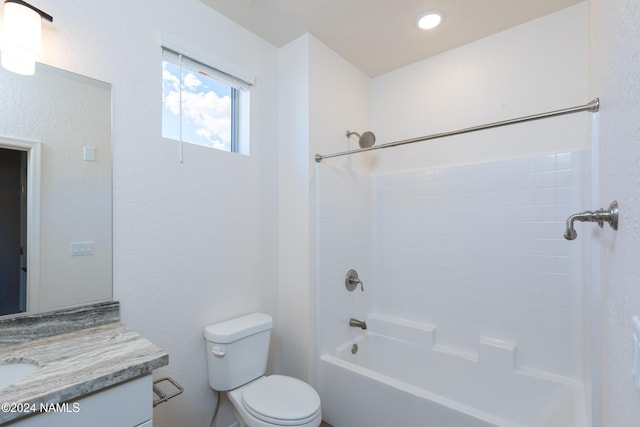 full bathroom featuring toilet, vanity, and bathing tub / shower combination