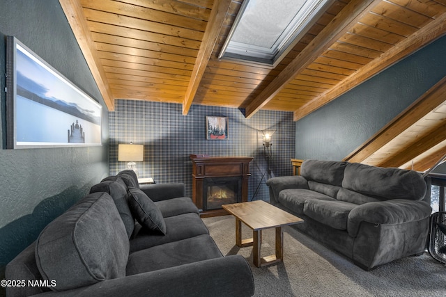 carpeted living area featuring a glass covered fireplace, wooden ceiling, a textured wall, and lofted ceiling with beams