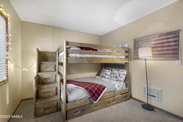 bedroom with carpet, visible vents, and baseboards