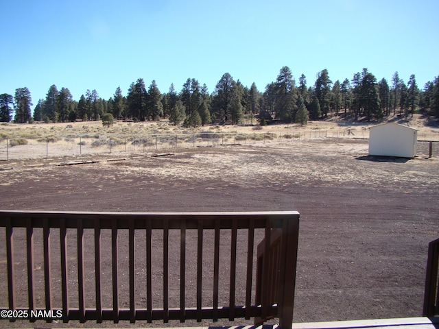 view of yard with a rural view