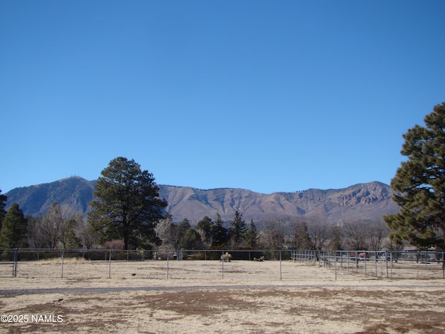 property view of mountains featuring a rural view