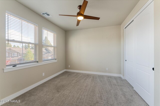 3223 S Beringer Ln, Flagstaff, AZ 86005 - unfurnished bedroom with a closet, light colored carpet, and ceiling fan