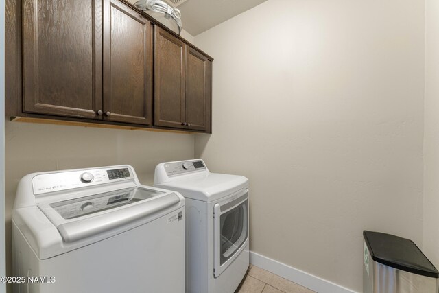 3223 S Beringer Ln, Flagstaff, AZ 86005 - laundry room featuring cabinet space, washing machine and clothes dryer, and light tile patterned flooring