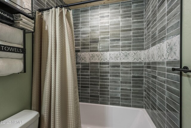 bathroom with toilet and shower / bathtub combination with curtain