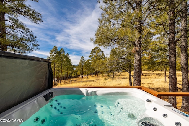 exterior space with a hot tub