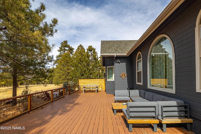 wooden terrace with outdoor lounge area