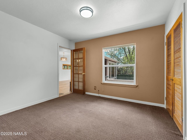 415 W Apache Rd, Flagstaff, AZ 86001 - unfurnished bedroom featuring carpet, a closet, and baseboards
