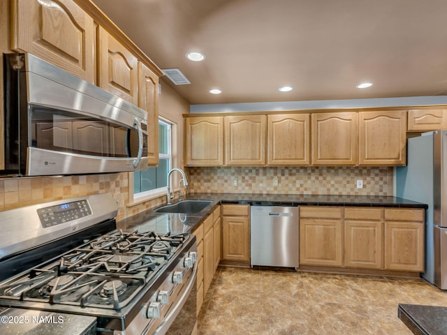 415 W Apache Rd, Flagstaff, AZ 86001 - kitchen with appliances with stainless steel finishes, a sink, light brown cabinetry, tasteful backsplash, and recessed lighting