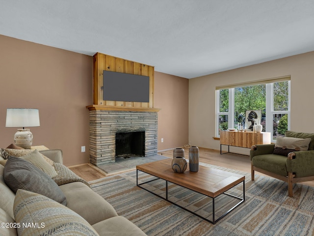 415 W Apache Rd, Flagstaff, AZ 86001 - living area featuring light wood-type flooring, baseboards, and a fireplace