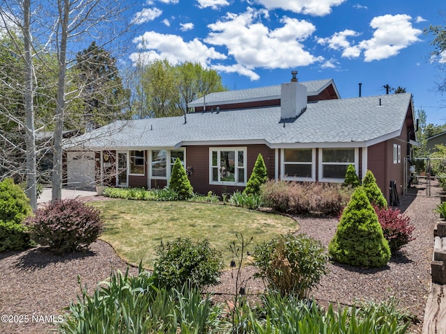 415 W Apache Rd, Flagstaff, AZ 86001 - view of front facade featuring a chimney, a front yard, and roof with shingles