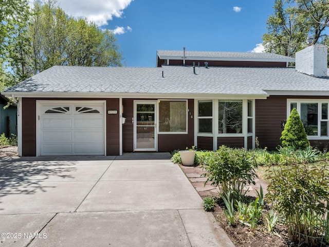 415 W Apache Rd, Flagstaff, AZ 86001 - ranch-style house featuring a garage, driveway, roof with shingles, and a chimney