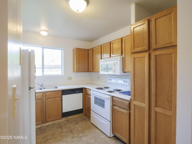 2401 N W St Unit 107, Flagstaff, AZ 86004 - kitchen with white appliances, a sink, light countertops, and brown cabinetry