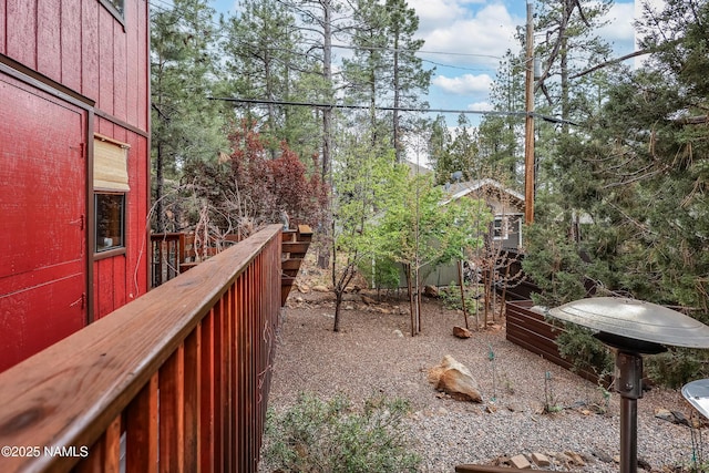 view of yard with a wooden deck