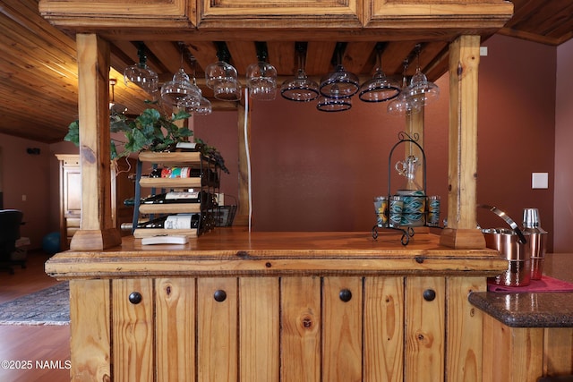 indoor bar featuring wood finished floors