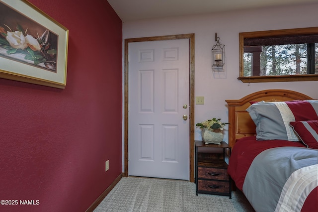 carpeted bedroom with baseboards