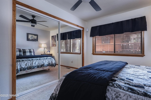 bedroom with carpet floors, a closet, baseboards, and a ceiling fan