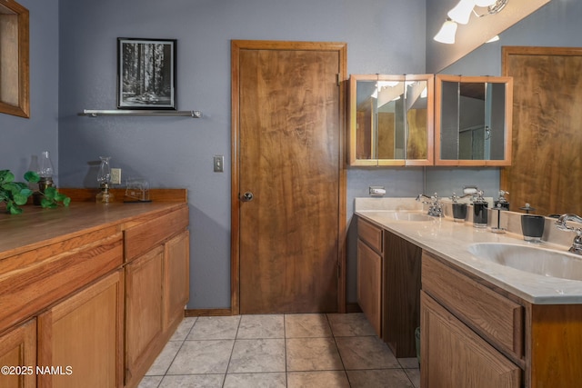 bathroom featuring double vanity and tile patterned flooring