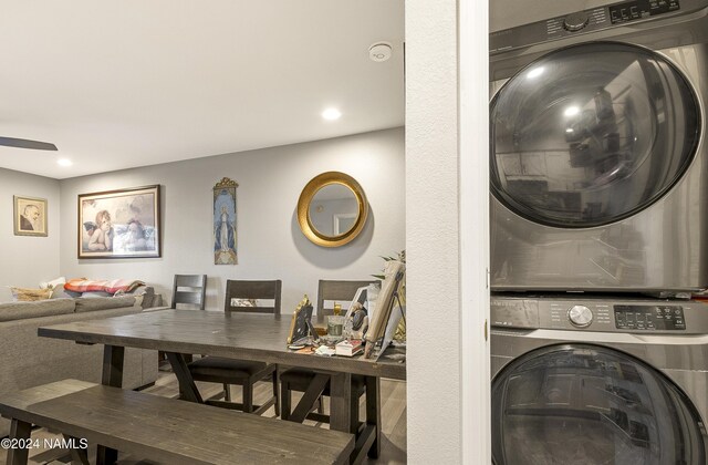 clothes washing area with stacked washer / drying machine